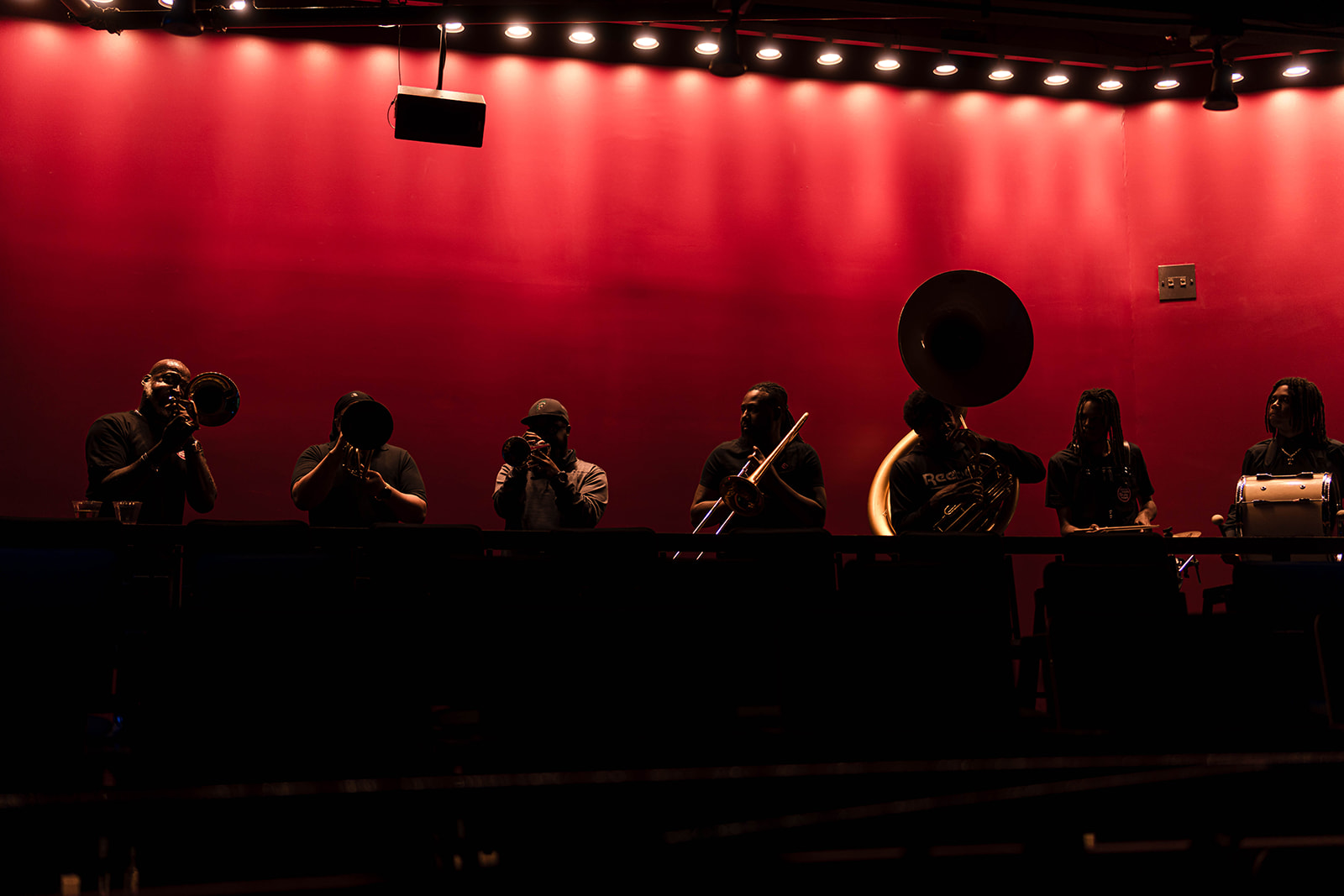 ACLU DC Bill of Rights Celebration brass band on red-lit stage