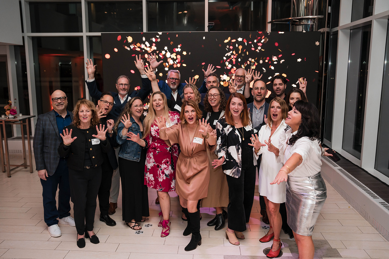 IA Interior Architects gala group photo with confetti celebration