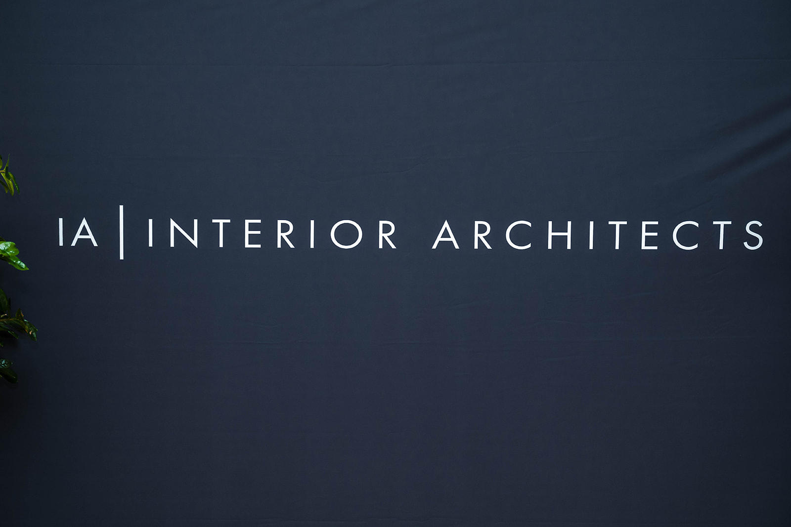 IA Interior Architects branded backdrop and event detail photography